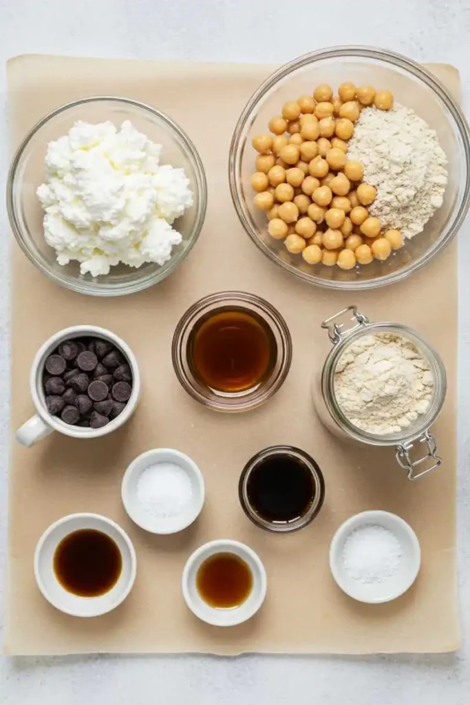 Ingredients for chickpea cottage cheese cookie dough arranged on parchment