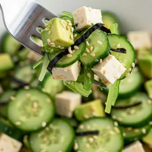 Close-up of California Roll Cucumber Salad on fork