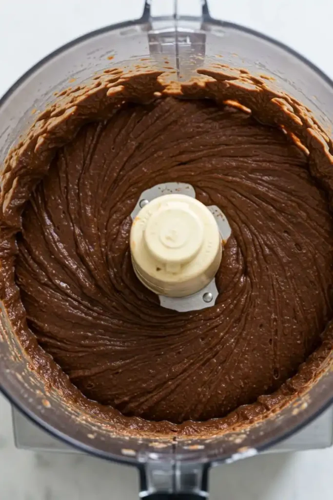 Blending flourless brownie batter in food processor