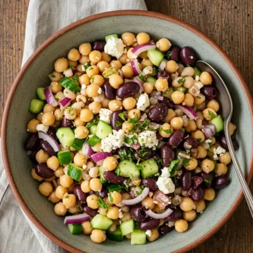 Vibrant Mediterranean dense bean salad recipe serving in rustic bowl